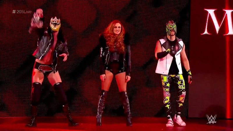 Maria Kanellis flanked by the masked TJP and Mike Kanellis
